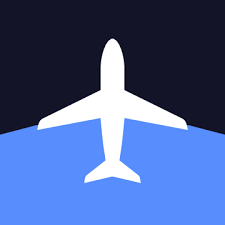 White airplane silhouette flying over a blue sea with a dark navy sky above.